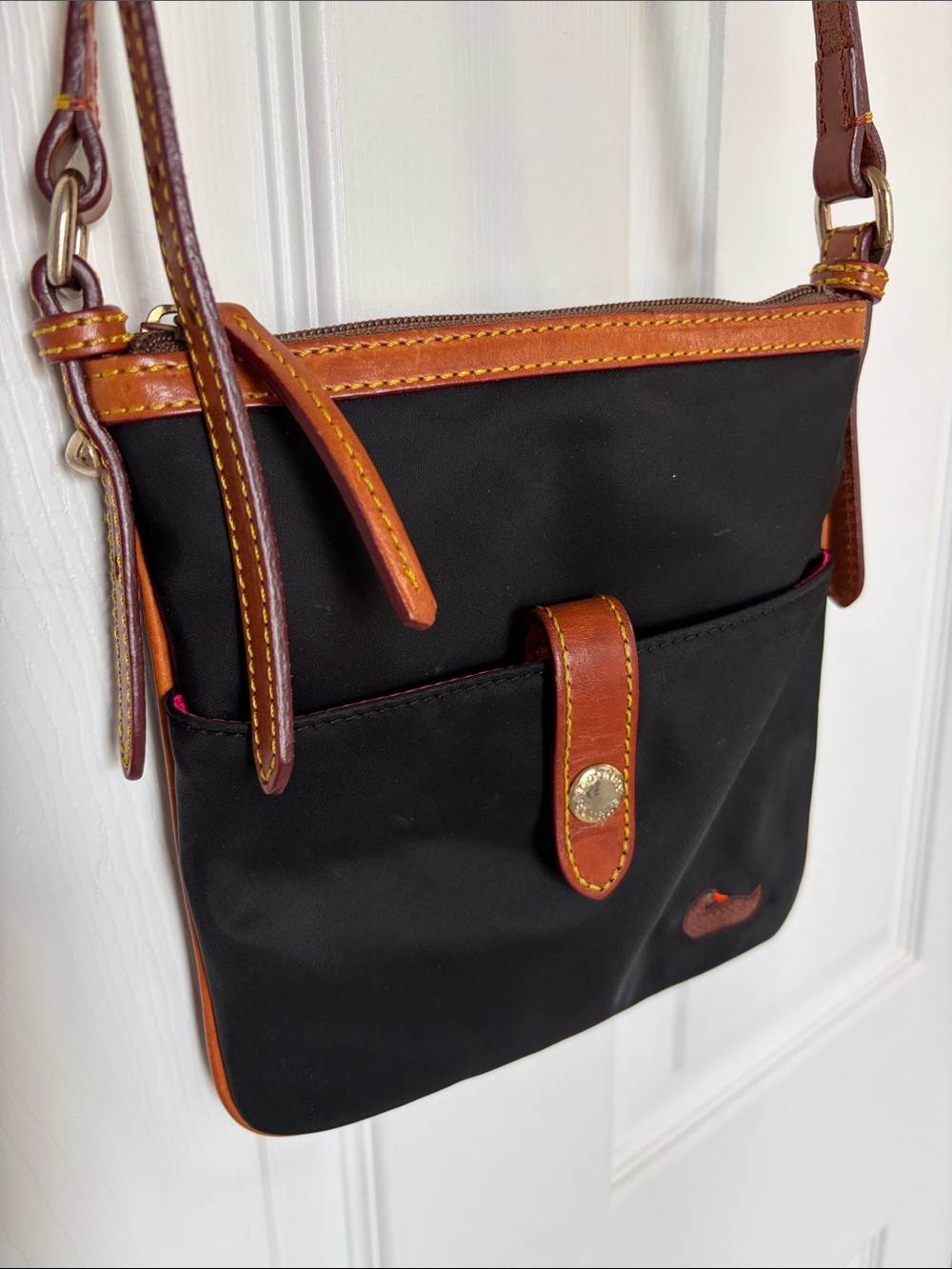 Dooney and Bourke Duck Black Crossbody Bag with Brown Leather Trim